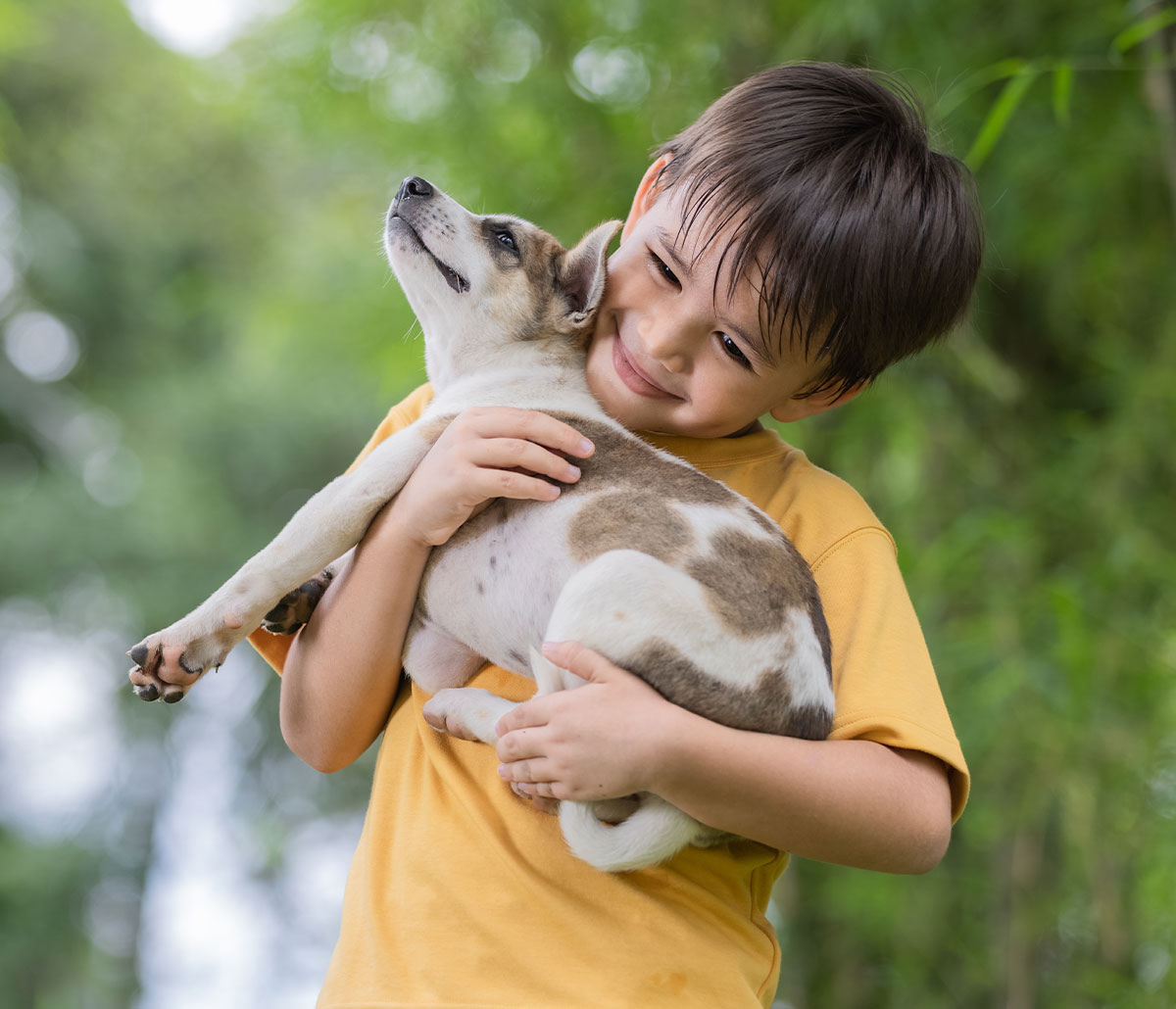 image of a child with a small dog